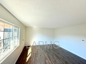 7039-7039 Miles Ave in Huntington Park, CA - Building Photo - Building Photo