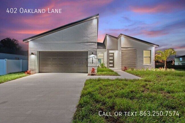 402 Oakland Ln in Poinciana, FL - Foto de edificio - Building Photo