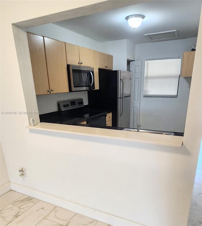 property at 902 NE 209th St
