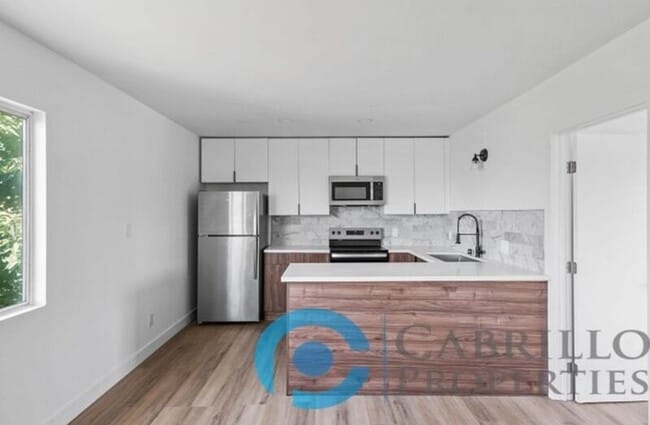 property at 207 E 1st St