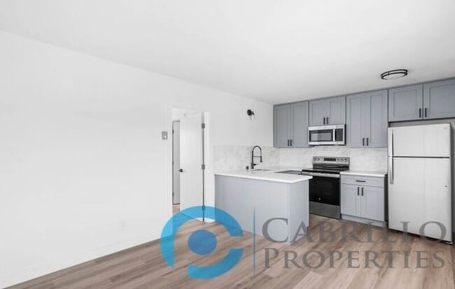 property at 207 E 1st St
