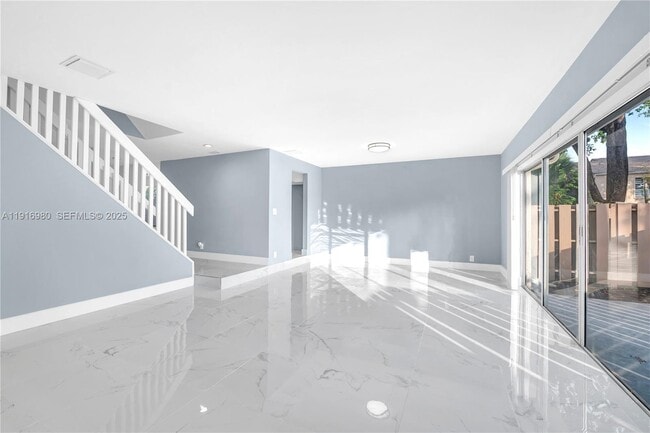 property at 8211 NW 8th St