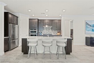 6767 Pennyroyal Dr in Naples, FL - Building Photo - Building Photo