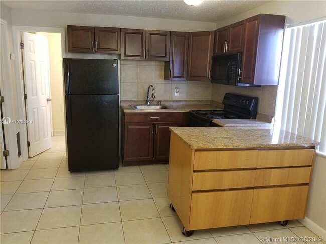 property at 5972 NW 19th St
