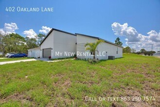 402 Oakland Ln in Poinciana, FL - Foto de edificio - Building Photo
