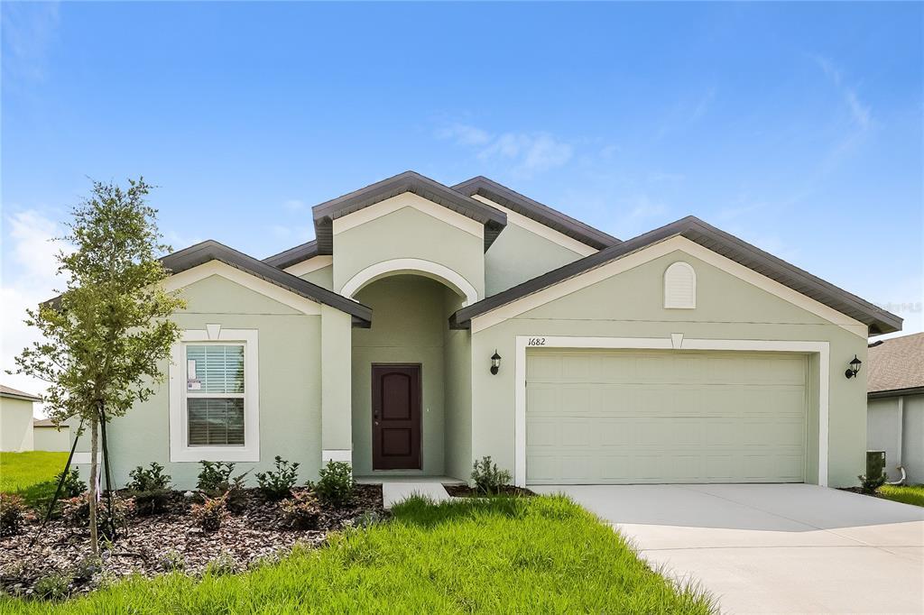 1682 Hideaway Flat St in Mascotte, FL - Building Photo