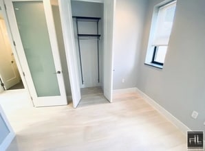 Stanton Street, Unit 6G in New York, NY - Building Photo - Building Photo