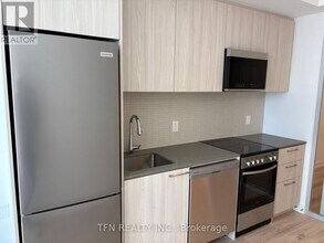 7439 Kingston Rd in Toronto, ON - Building Photo - Building Photo