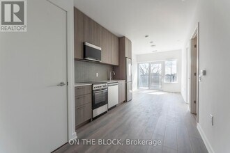 7437 Kingston Rd in Toronto, ON - Building Photo - Building Photo