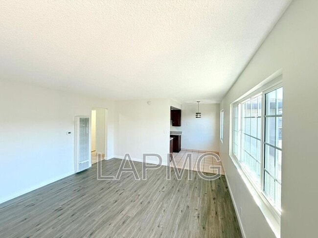 7039-7039 Miles Ave in Huntington Park, CA - Building Photo - Building Photo