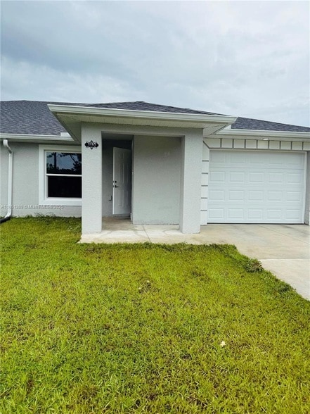 1110 Augusta St E in Lehigh Acres, FL - Building Photo - Building Photo