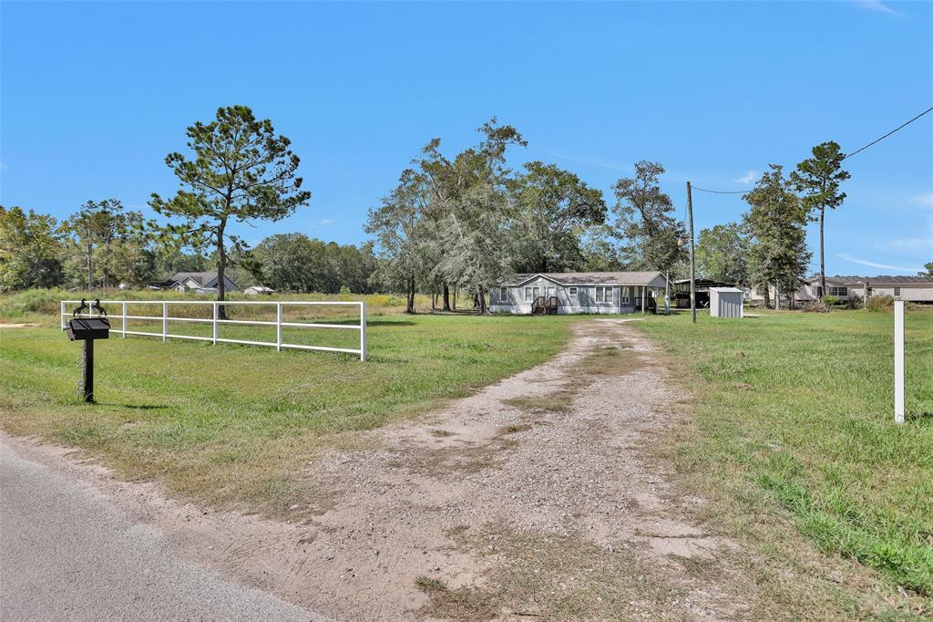 12180 Rebel Rd in Cleveland, TX - Building Photo