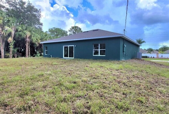 407 Treemont Ave in Palm Bay, FL - Building Photo - Building Photo
