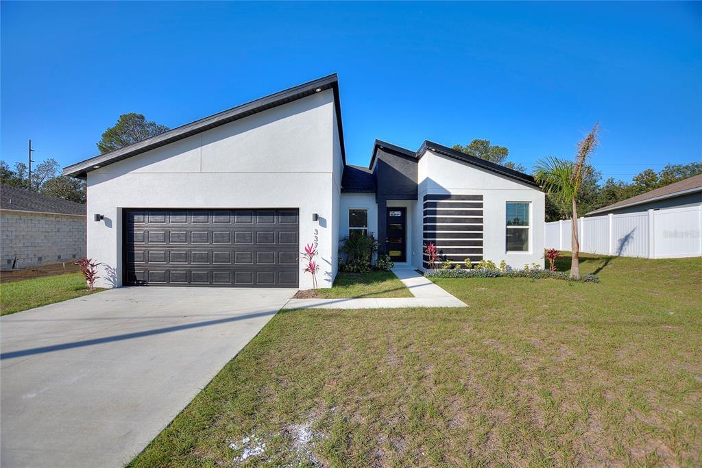 337 Hibiscus Dr in Poinciana, FL - Building Photo