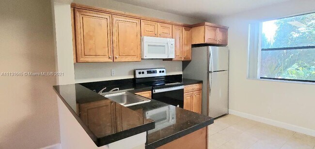 5701 Riverside Dr-Unit -201B in Coral Springs, FL - Building Photo - Building Photo