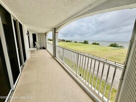 8934 Puerto Del Rio Dr in Cape Canaveral, FL - Building Photo