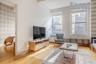 67 Wall St, Unit FL13-ID13 in New York, NY - Building Photo - Building Photo