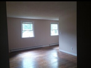 122 Pleasant St, Unit 3 in Franklin, NH - Building Photo - Building Photo