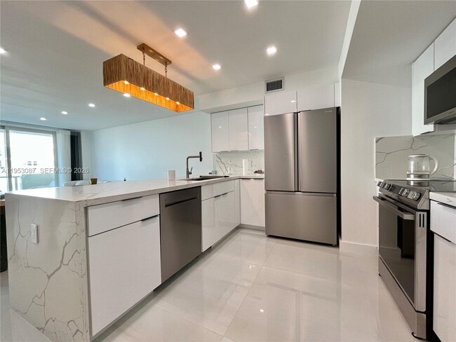 property at 9499 Collins Ave