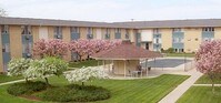 Building Photo - The Poplars Apartments in Saginaw, Michigan