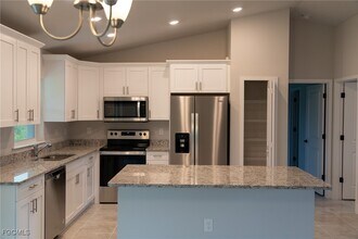 409 Moore Ave in Lehigh Acres, FL - Building Photo - Building Photo