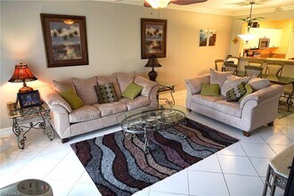 7842 Regal Heron Cir-Unit -101 in Naples, FL - Building Photo - Building Photo