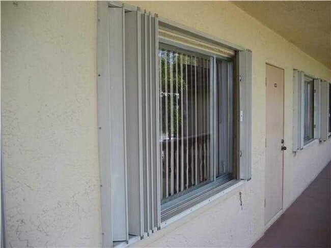 500 Village Green Cir W in Palm Springs, FL - Building Photo - Building Photo
