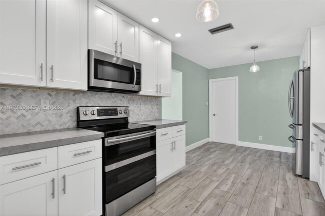 7613 NW 67th Ave in Tamarac, FL - Building Photo - Building Photo