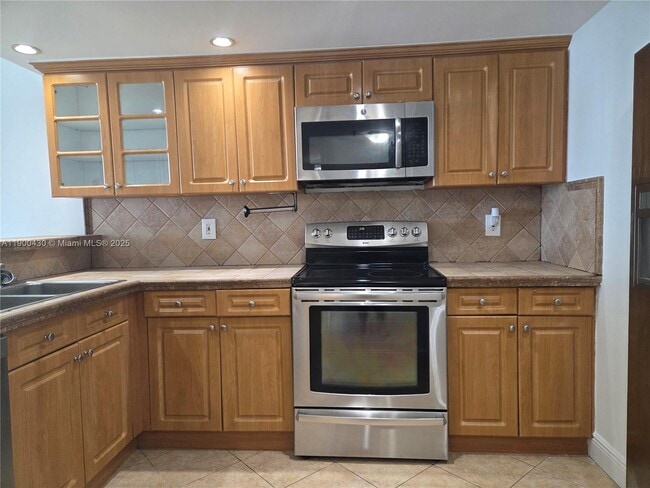 property at 5880 Collins Ave