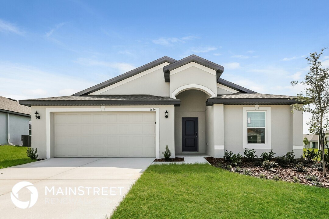 1674 Hideaway Flat St in Mascotte, FL - Building Photo