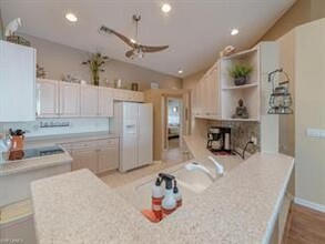 25073 Peacock Ln-Unit -201 in Naples, FL - Building Photo - Building Photo