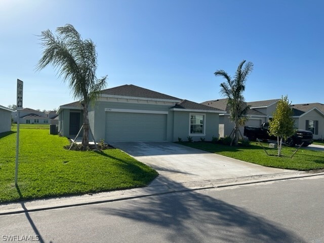 12142 Amber Waves Rd in Lehigh Acres, FL - Building Photo