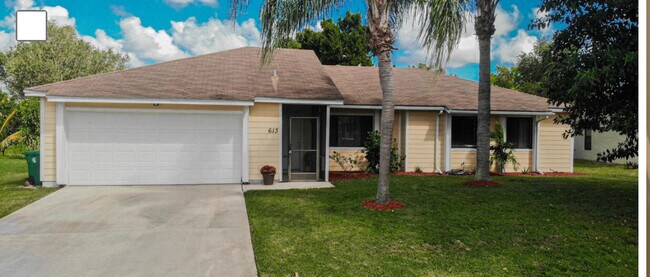property at 613 SW Lucero Dr