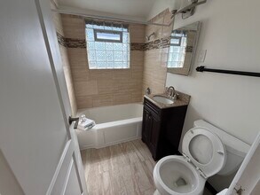204 N Locust St, Unit 1 in Oconomowoc, WI - Building Photo - Building Photo
