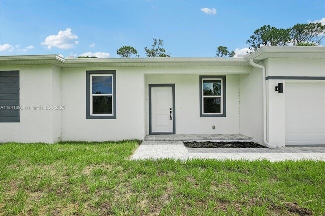 11992 Atoll Ave in Port Charlotte, FL - Building Photo - Building Photo