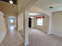 1315 Moss Creek Ln in Champions Gate, FL - Foto de edificio - Building Photo