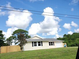 1734 SW Carolina St in Port St. Lucie, FL - Building Photo