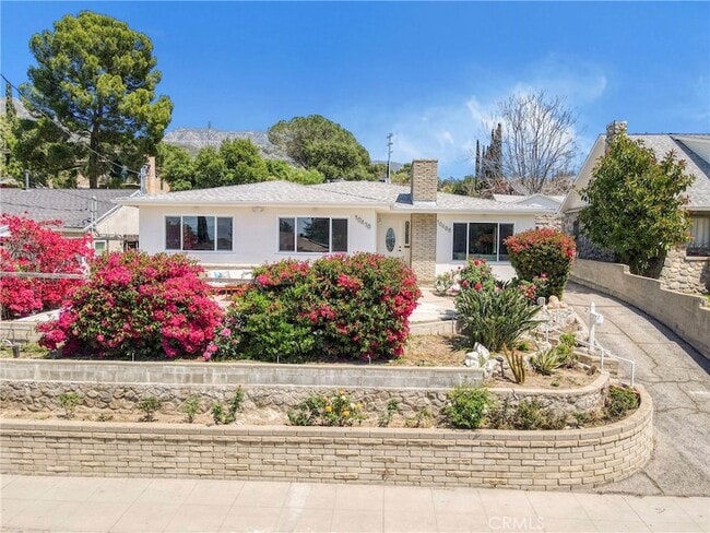 property at 10410 Mountair Ave