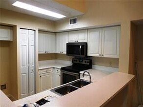 1210 Wildwood Lakes Blvd-Unit -202 in Naples, FL - Building Photo - Building Photo