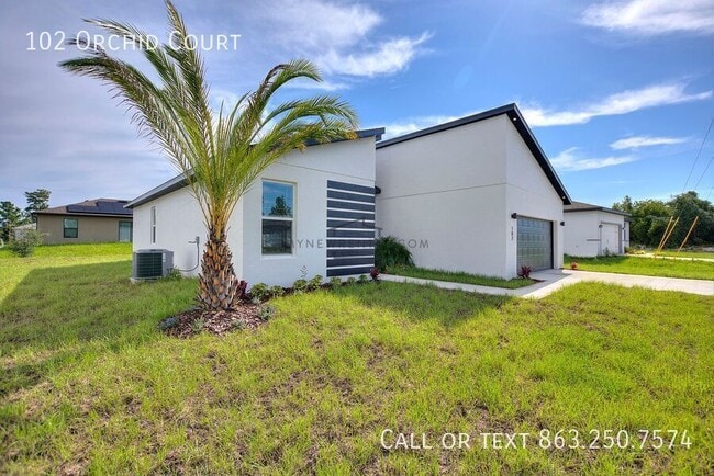 102 Orchid Ct in Poinciana, FL - Foto de edificio - Building Photo