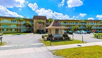 400 Village Green 216 Cir in Palm Springs, FL - Building Photo