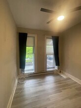 2841 N Calvert St, Unit 1F in Baltimore, MD - Foto de edificio - Building Photo