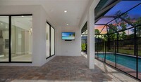 6878 Winding Cypress Dr in Naples, FL - Foto de edificio - Building Photo