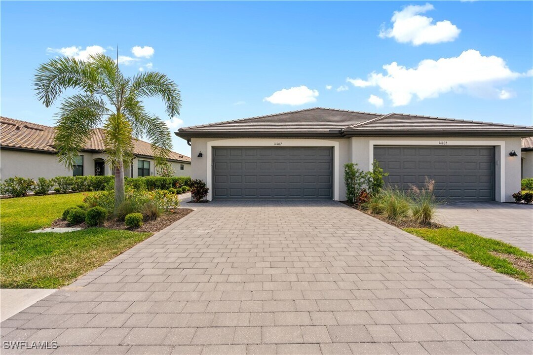 14107 Winding Cedar Wy in Miromar Lakes, FL - Building Photo