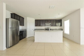 1689 Hideaway Flat St in Mascotte, FL - Building Photo - Building Photo