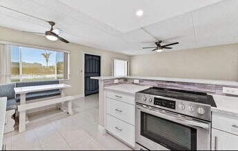 100 Village Green Cir E in Palm Springs, FL - Building Photo - Building Photo