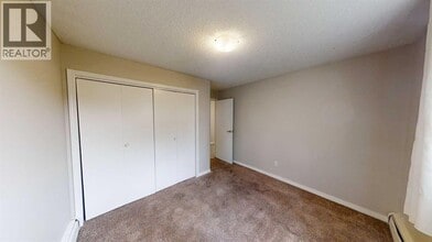 10114-10105 105 Ave in Grande Prairie, AB - Building Photo - Building Photo