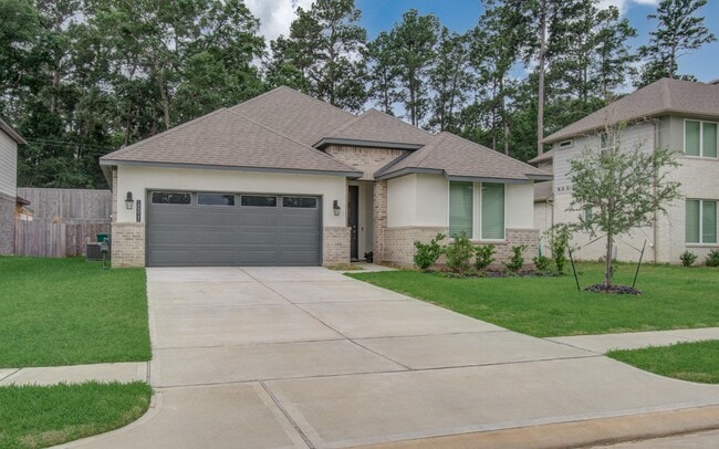 10011 Angelina Wds Ln in Conroe, TX - Foto de edificio - Building Photo