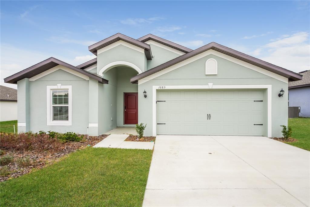 1685 Hideaway Flat St in Mascotte, FL - Building Photo