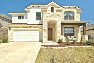 303 Cherrystone Loop in Mustang Ridge, TX - Building Photo